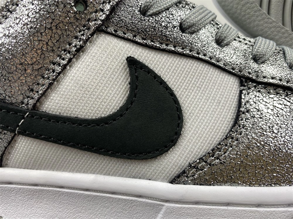 The Nike Dunk Low Features Silver Cracked Leather  DO5882-001