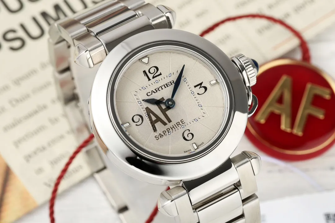 Cartier Pasha de Cartier Stainless Steel Automatic Watch with White Dial, Blue Hands, and Sapphire Crystal – Silver Tone Bracelet FashionForward 2814
