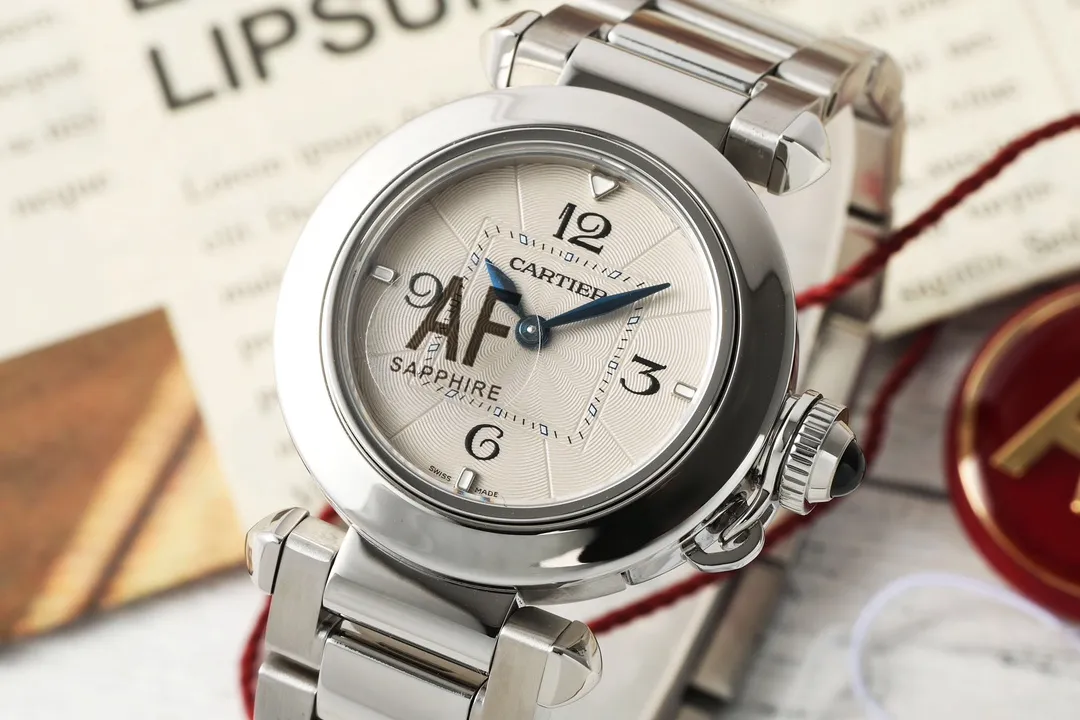 Cartier Pasha de Cartier Stainless Steel Automatic Watch with White Dial, Blue Hands, and Sapphire Crystal – Silver Tone Bracelet FashionForward 2814