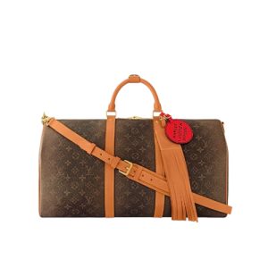 M11541 Monogram Dust coated canvas Aged cowhide leather trim Textile lining  Goldtoned hardware Keepall Bandoulière 50